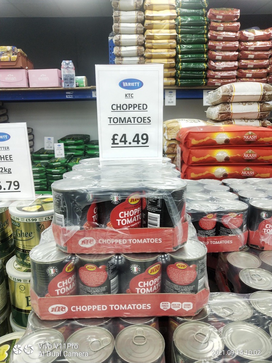 Grocery shelves inside Gifts Shopping Centre with rice, pulses and tinned goods